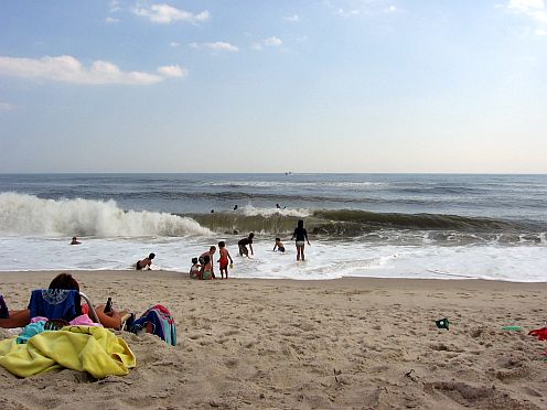 kids playing in the waves