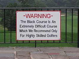 a sign warning that the black course is extremely difficult