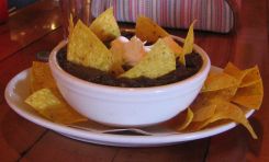 Black bean soup with sour cream and chips