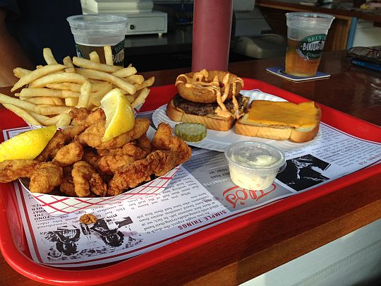 fried clams and a cheeseburger on a lunch tray