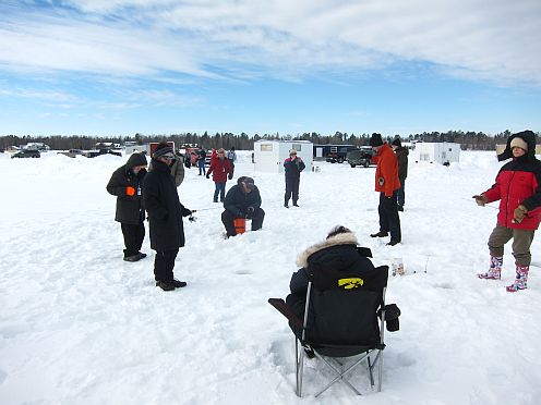 People ice fishing.