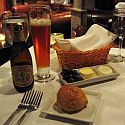 Beer, bread, and butter on a table