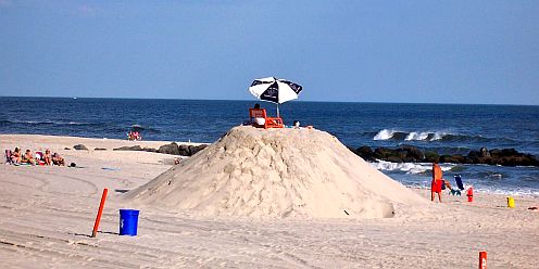 lifeguards on a huge sand pile