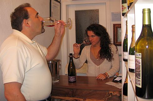 people tasting wine