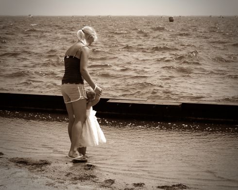 Mother and baby on a beach